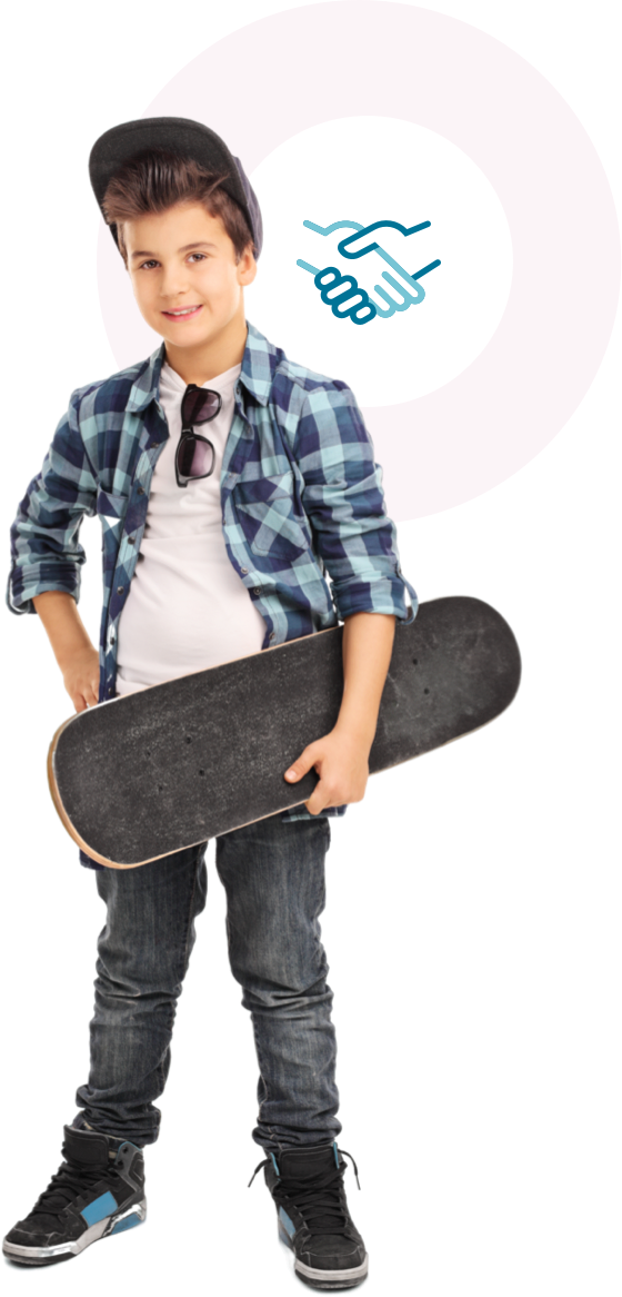 Boy wearing a hat and holding a skateboard